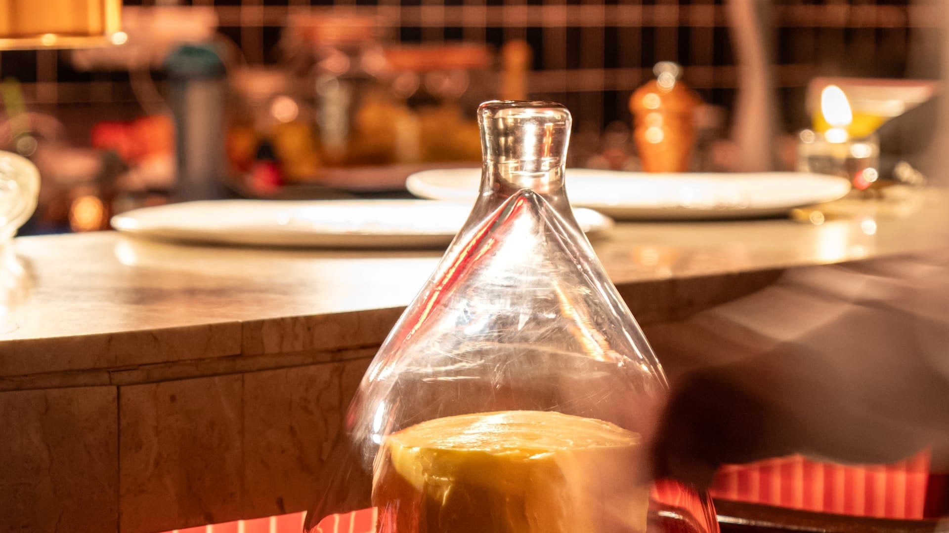 A curl of French butter lifted from a whole block with a warm spoon at Bisou, a modern French restaurant in Cherngtalay, Phuket