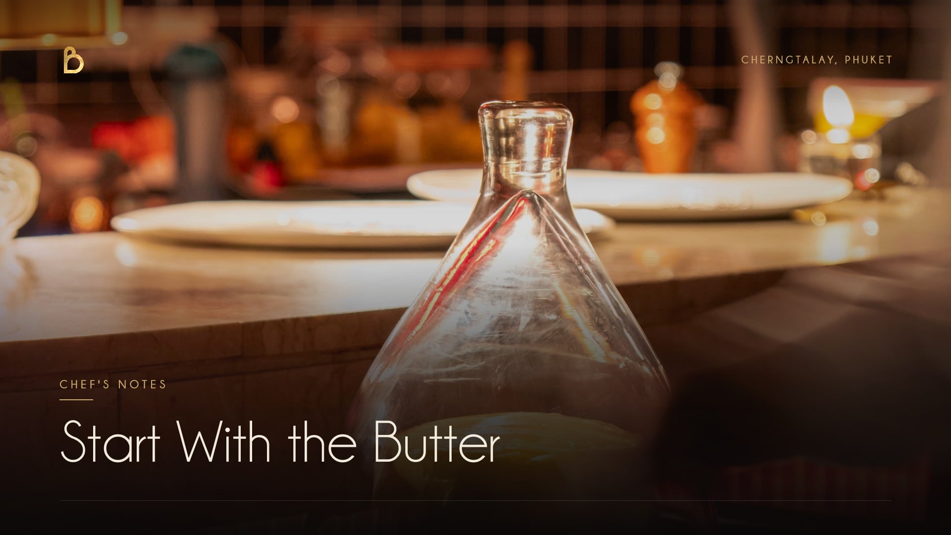 A curl of French butter lifted from a whole block with a warm spoon at Bisou, a modern French restaurant in Cherngtalay, Phuket