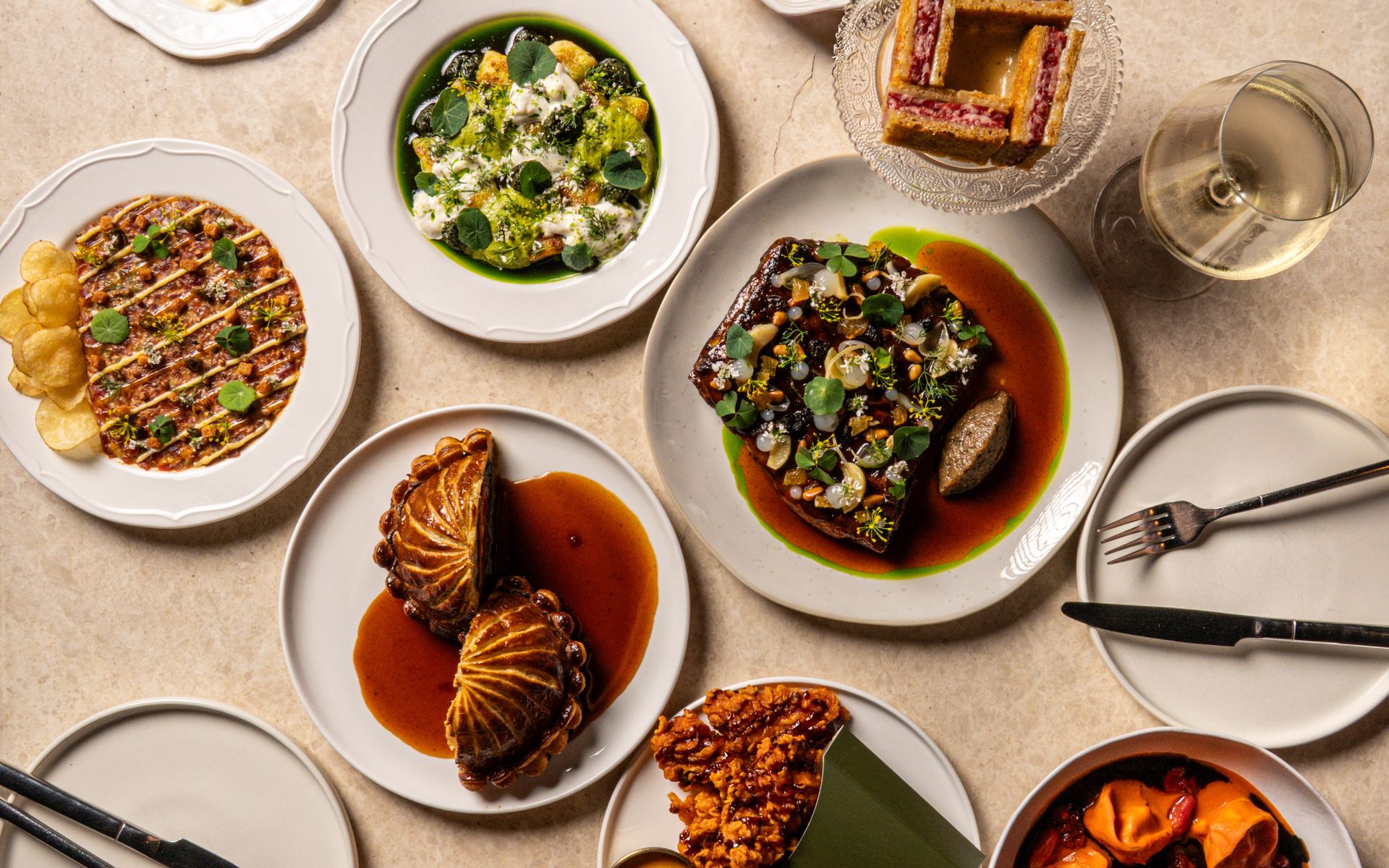 An overhead spread of modern French dishes at Bisou, a French restaurant in Cherngtalay, Phuket