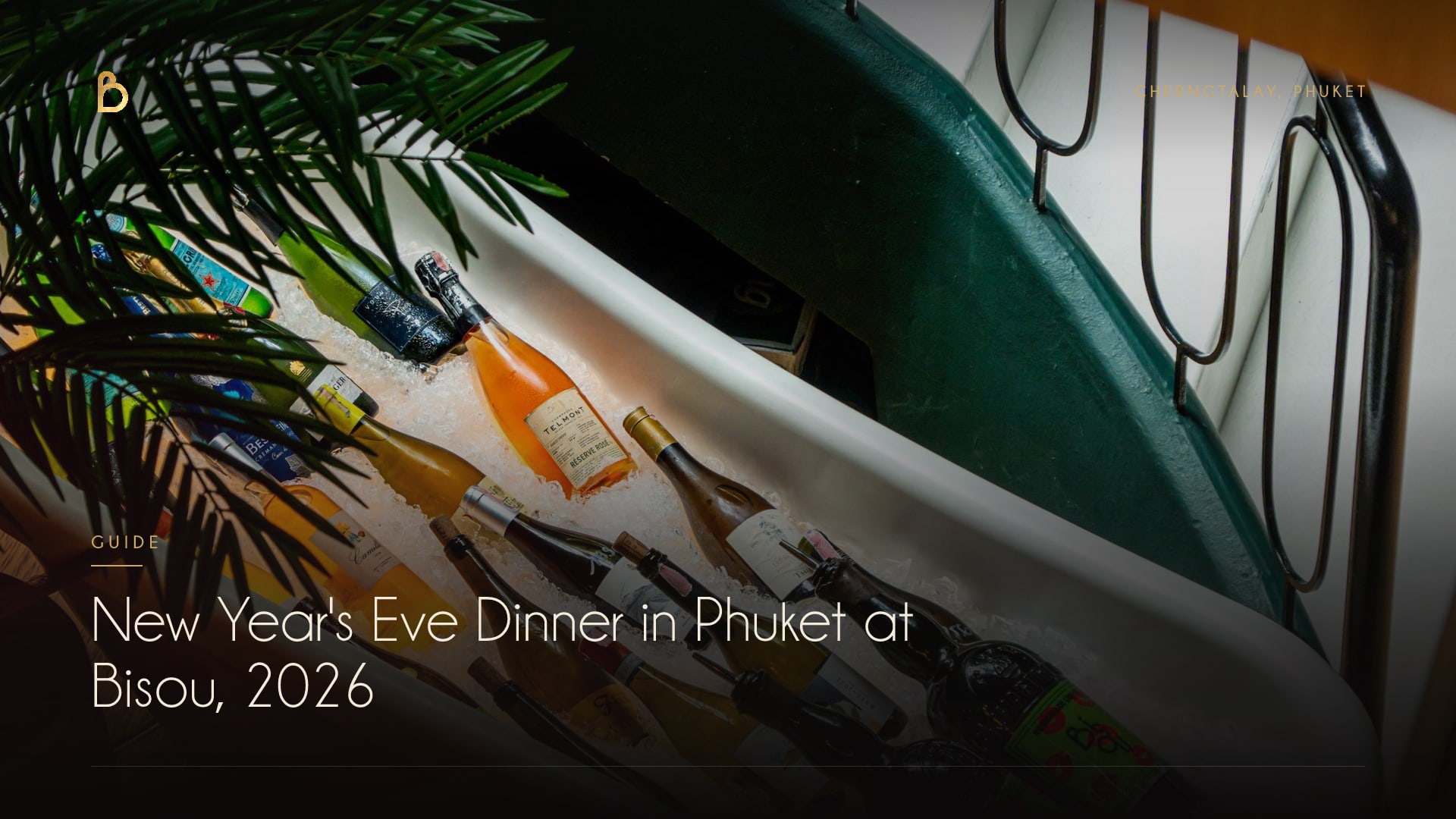 Bottles of Champagne, rosé and white wine on crushed ice in a claw-foot bathtub by the spiral staircase at Bisou Phuket, a modern French restaurant in Cherngtalay
