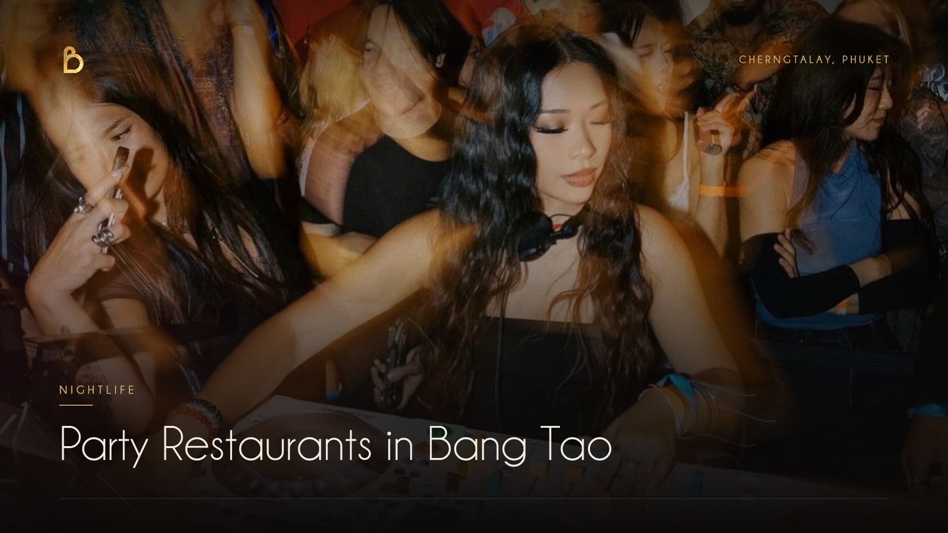 The lit facade of Bisou, a modern French restaurant and cocktail bar in Cherngtalay near Bang Tao Beach, where dinner turns into a night out with a weekly DJ