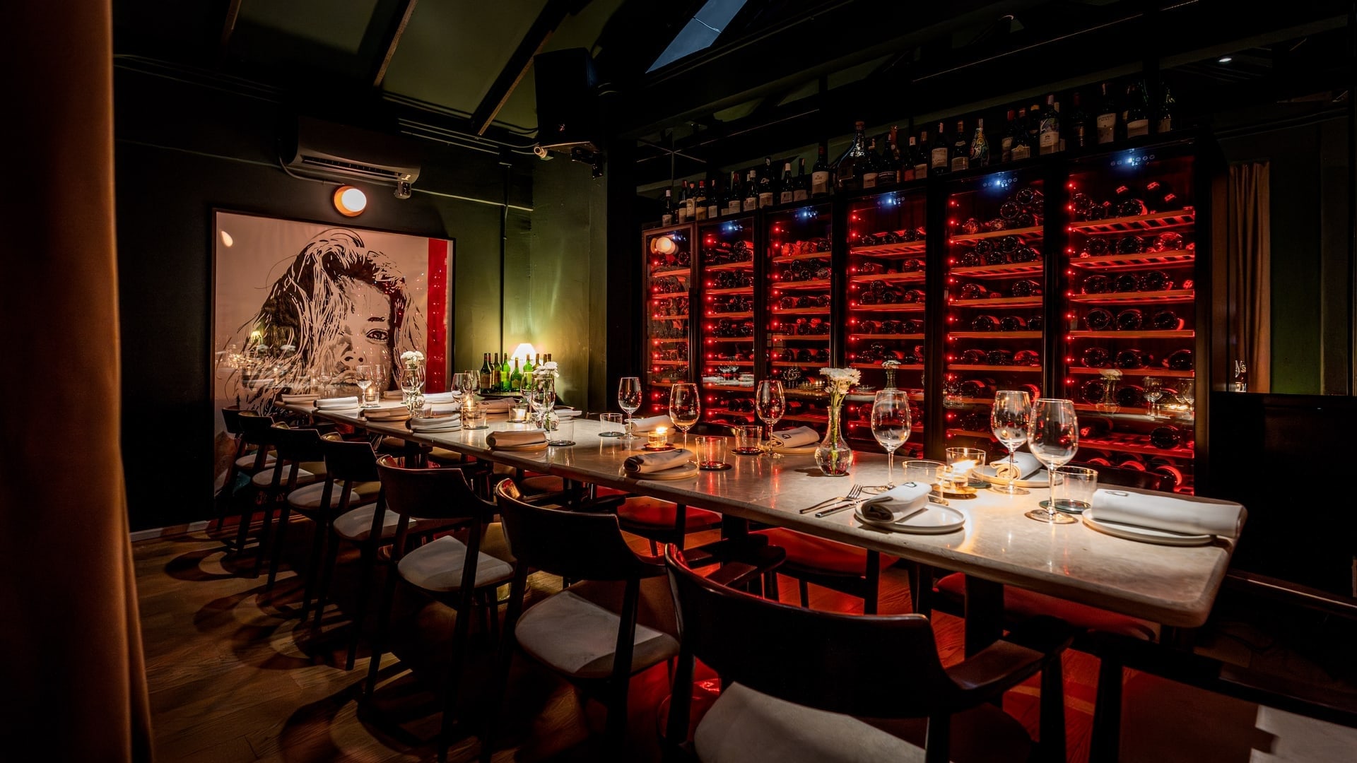 The private dining table at Bisou, a modern French restaurant in Cherngtalay near Laguna and Bang Tao, Phuket, set in front of the wine cellar